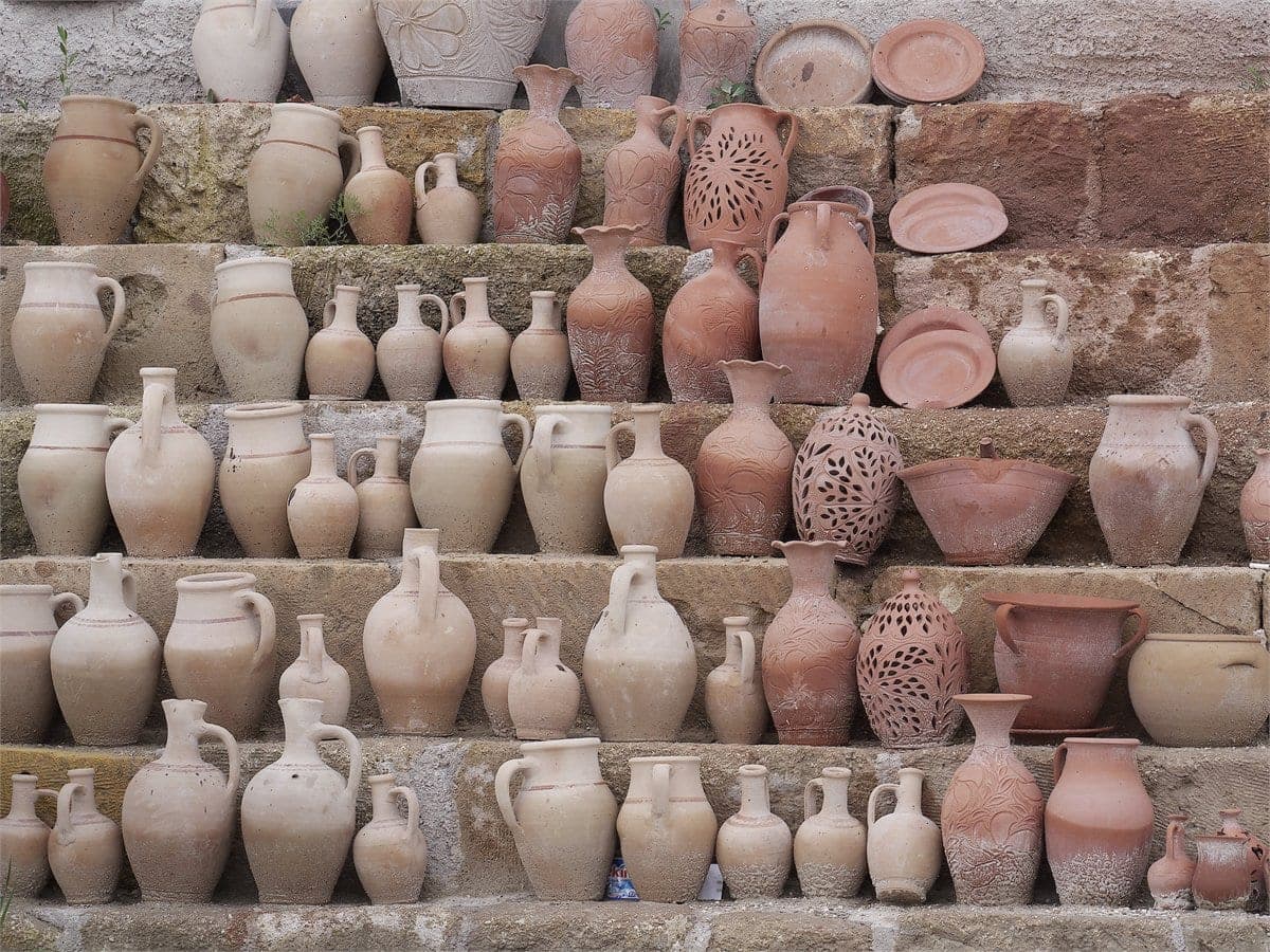 Shelves of red-clay pottery on display at a workshop in Avanos, Cappadocia